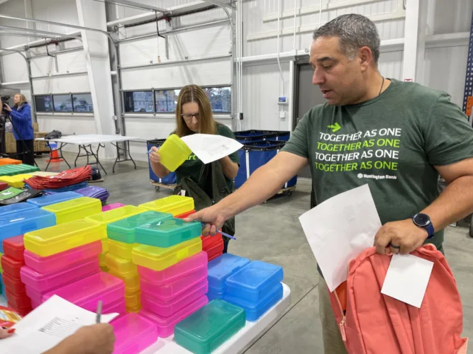 Volunteers stuff the bus